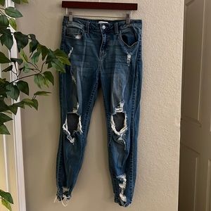 Distressed looser fit skinny jeans